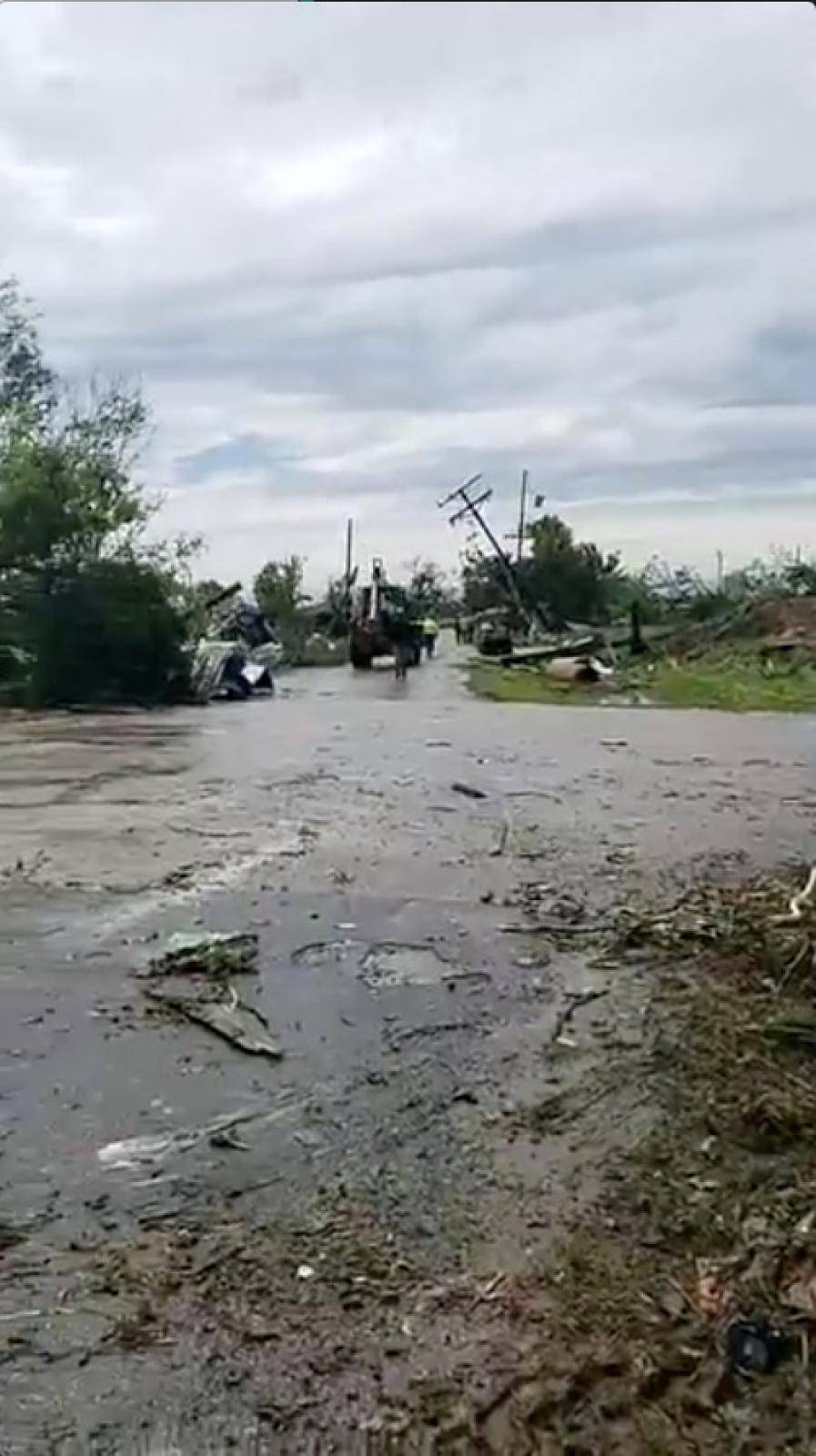 People work to clear debris in the aftermath of a tornado in Franklin, Texas, U.S., in this still image from social media video