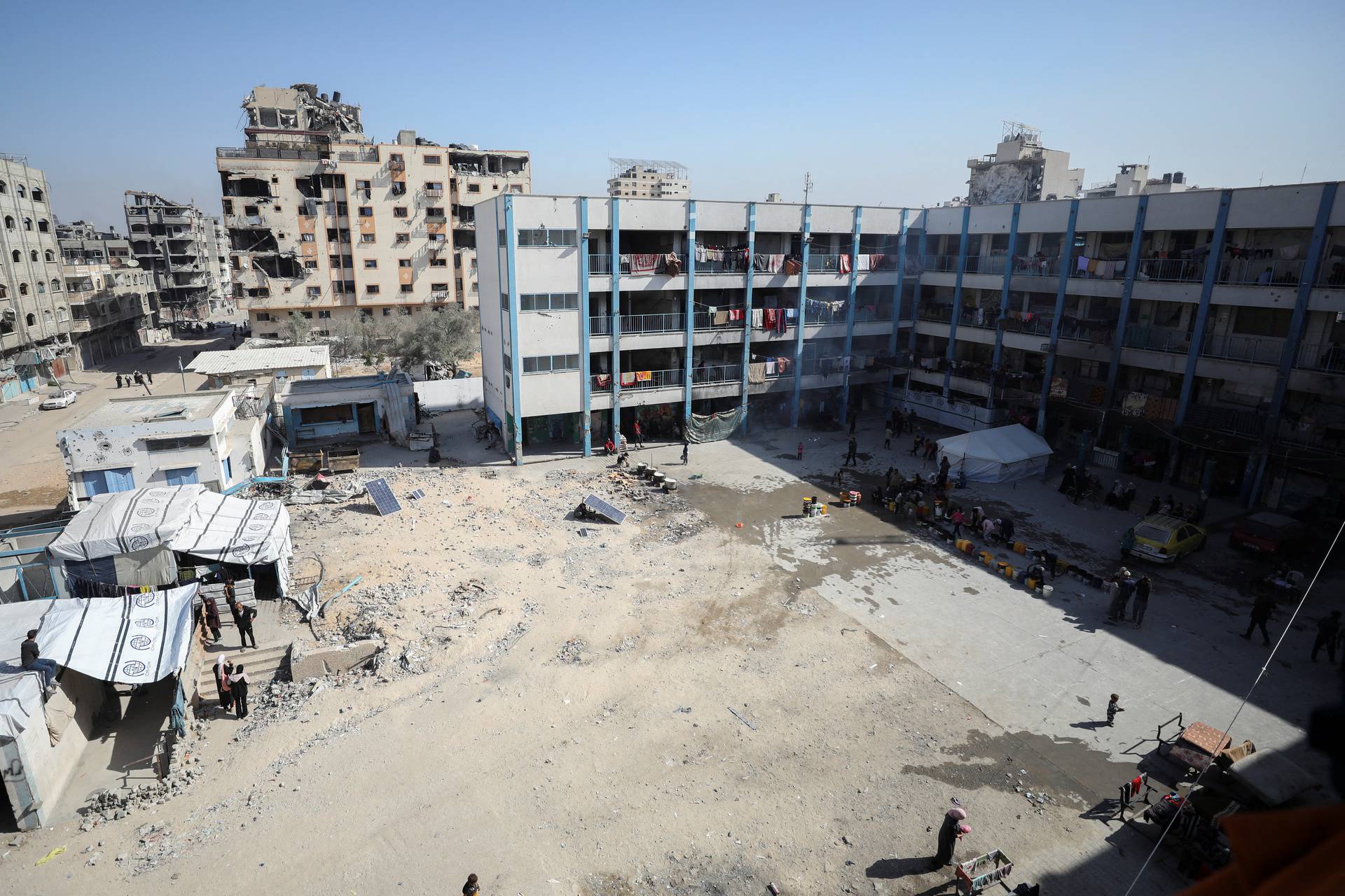 Displaced Palestinians including those who fled areas in northern Gaza due to an Israeli military operation, shelter in a school in Gaza City