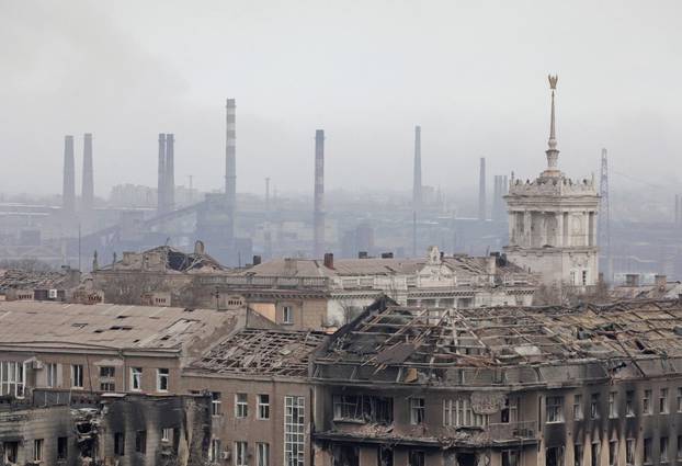 A view shows a plant of Azovstal Iron and Steel Works company behind damaged buildings in Mariupol