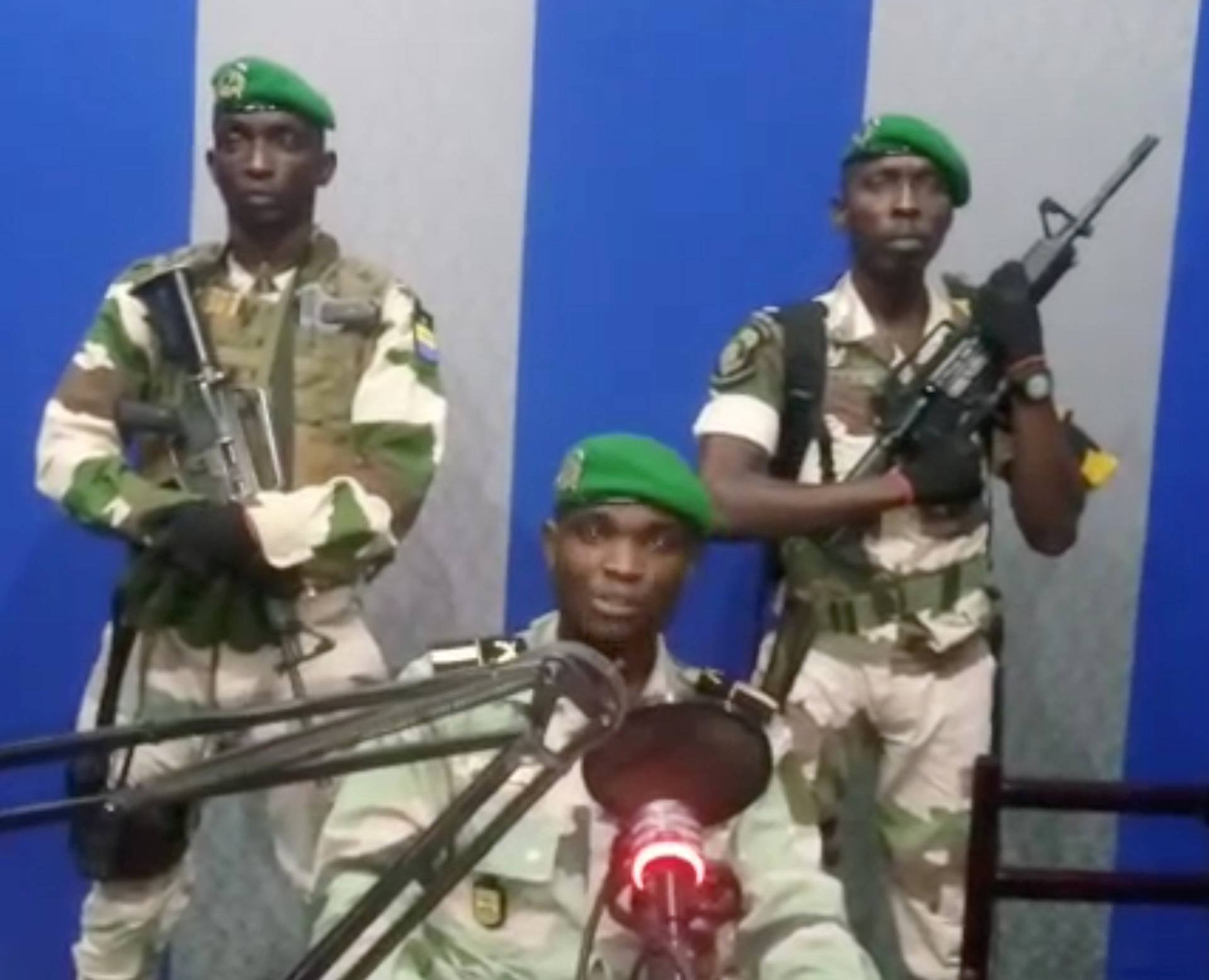 A still image taken from a video shows military officers giving a statement from a radio station in Libreville