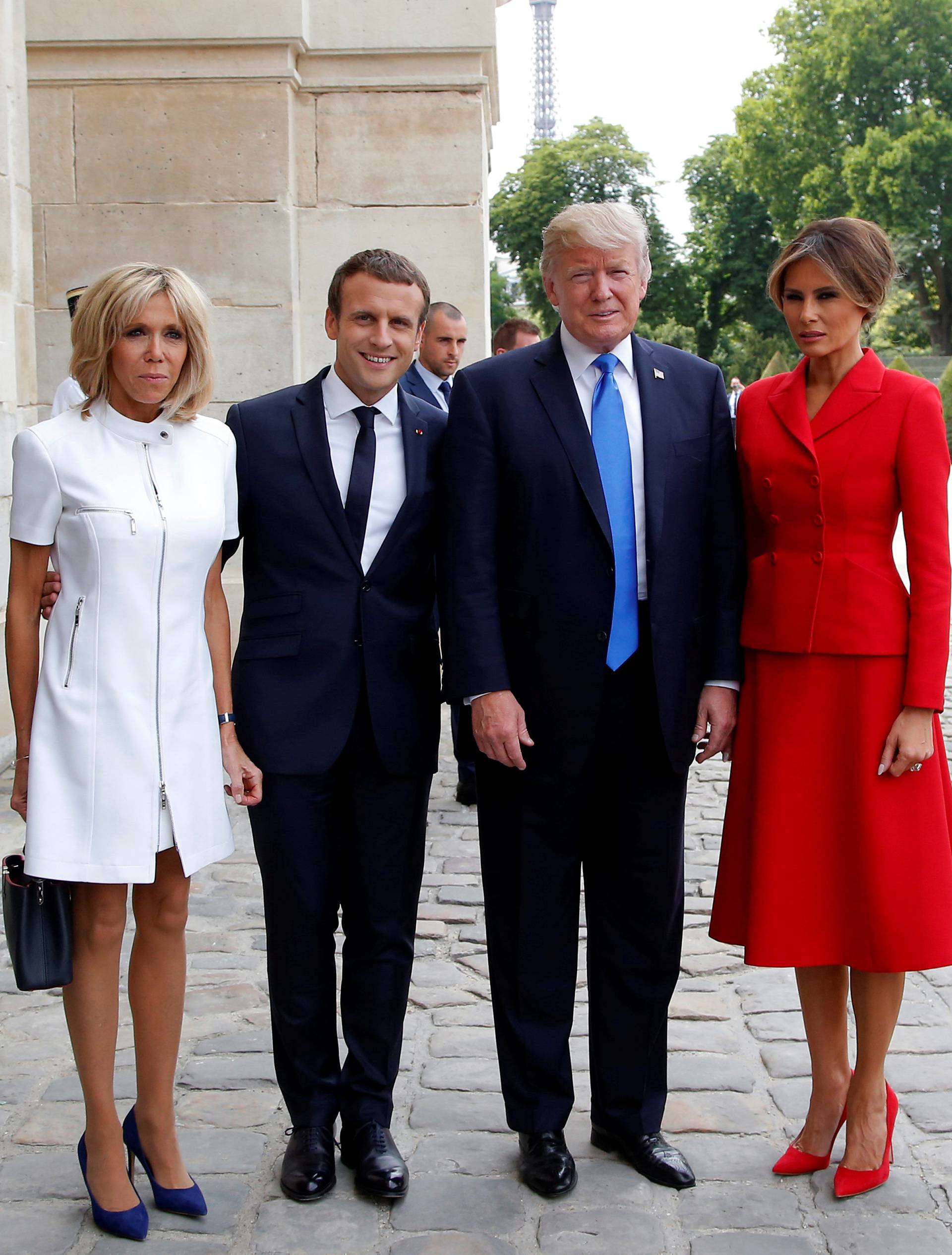 French President Emmanuel Macron and his wife Brigitte pose with US President Donald Trump and First Lady Melania Trump at Les Invalides museum in Paris