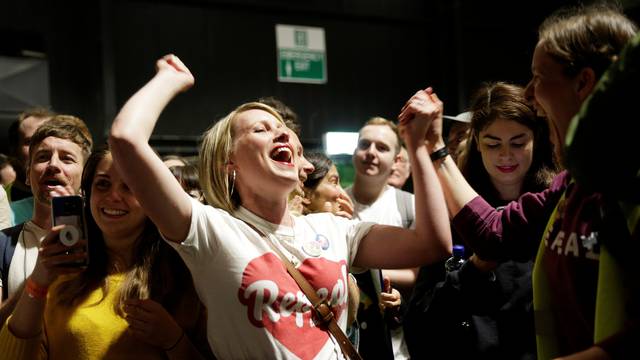 Activists react at the count centre as votes are tallied folowing yesterday's referendum on liberalizing abortion law, in Dublin