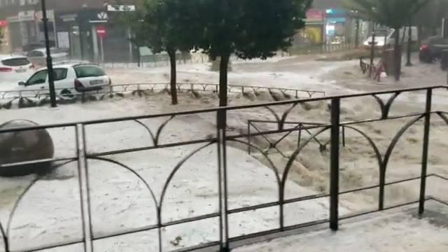 Cars are seen during the heavy rains in Arganda del Rey, Madrid