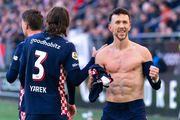 Utrecht, Netherlands. 21st Dec, 2025. UTRECHT, NETHERLANDS - DECEMBER 21: Ivan Perisic of PSV celebrates after scoring the team's second goal with Yarek Gasiorowski of PSV during the Dutch Eredivisie match between FC Utrecht and PSV at Stadion Galgenwaard