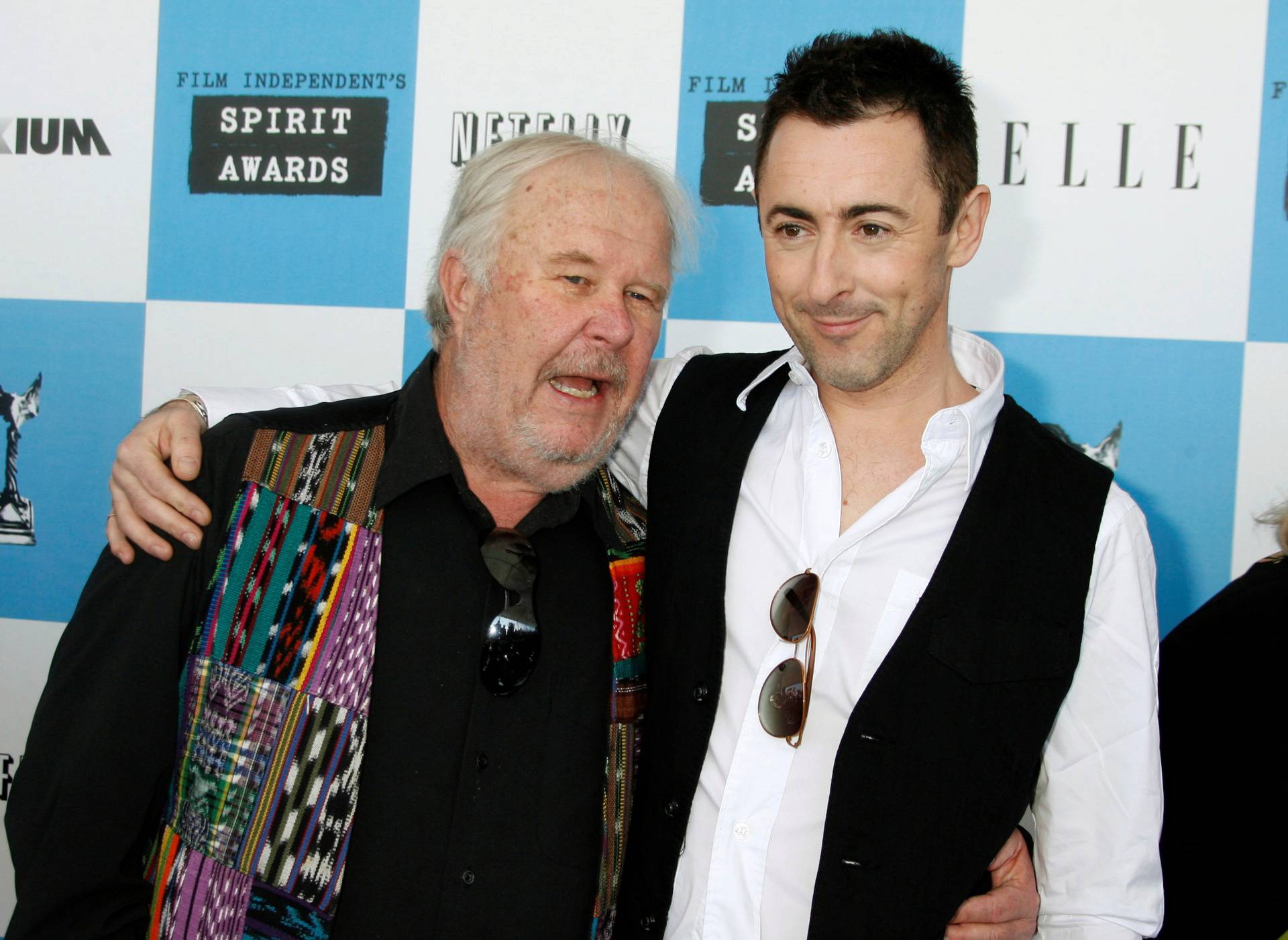 FILE PHOTO: Actors Ned Beatty and Alan Cumming arrive at Film Independent's Spirit Awards in Santa Monica