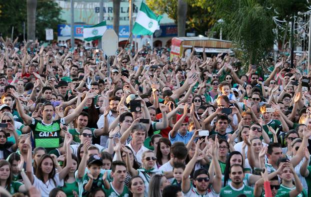 Fans of Chapecoense soccer team gather the streets in tribute of their players in Chapeco