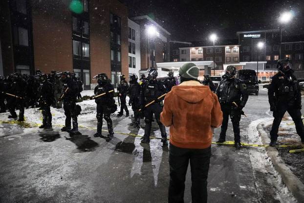 Protest outside the hotel where Bovino, who has been removed from his role, is reportedly staying, in Maple Grove