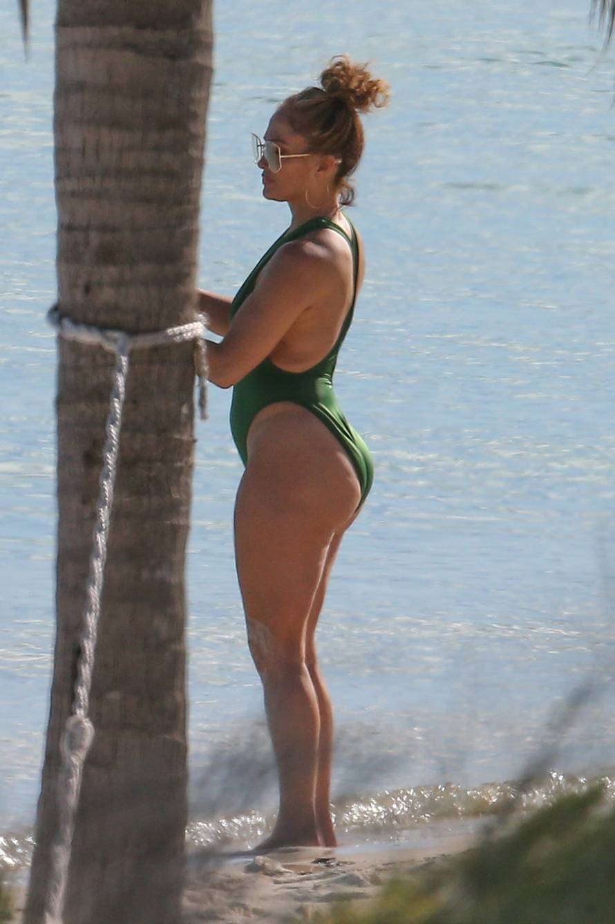 *PREMIUM-EXCLUSIVE* Jennifer Lopez is pictured in plunging green swimsuit as she soaks in the sun in Turks and Caicos **Web Embargo until 1 pm PST on January 15, 2021**