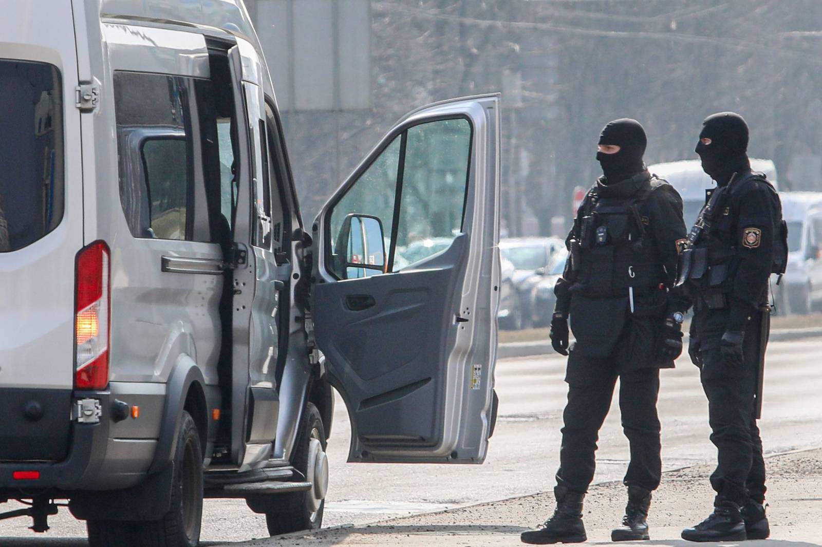 Law enforcement officers patrol a street, as Belarusian opposition supporters gather for a rally in Minsk