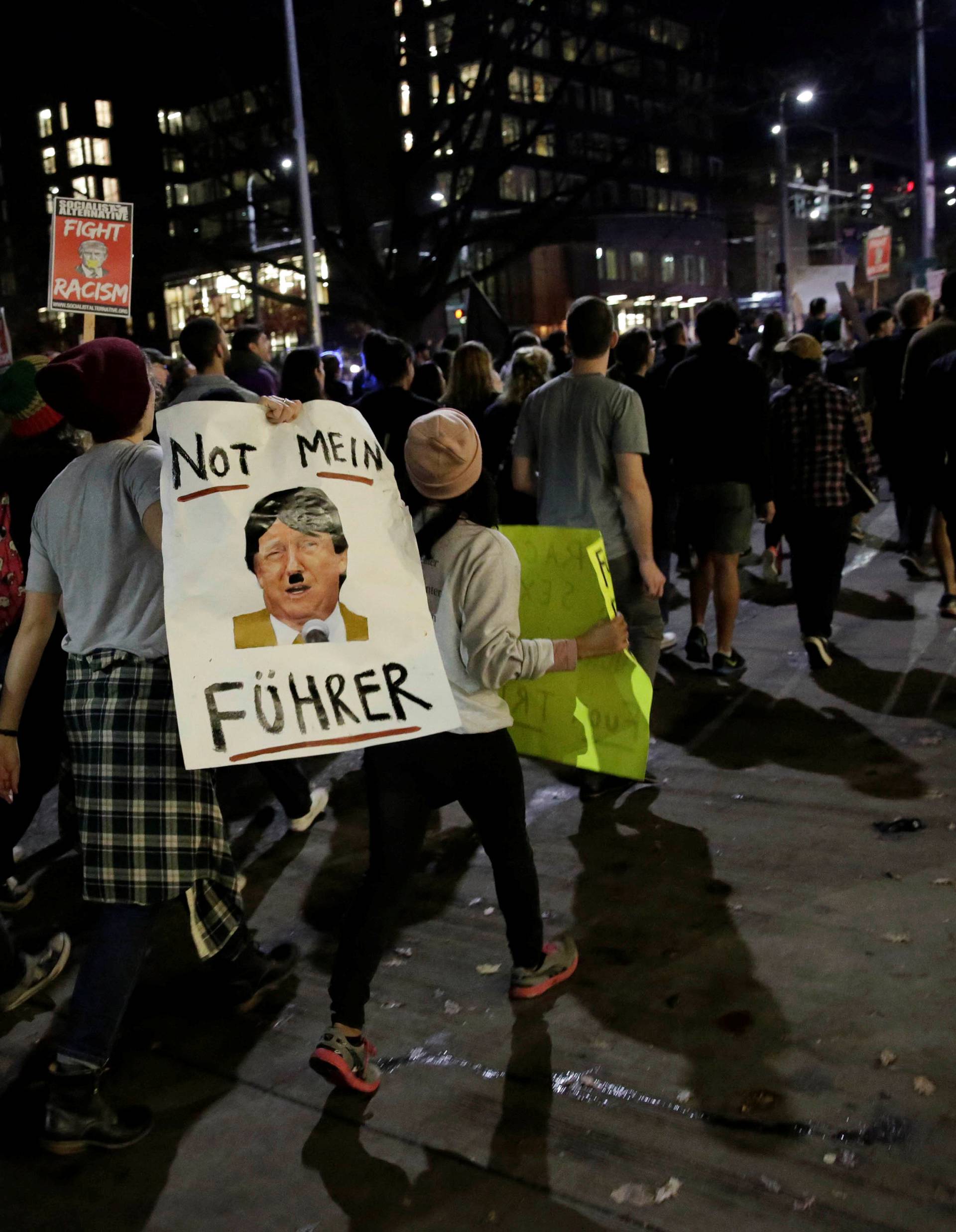 People march in protest to the election of Republican Donald Trump as the president of the United States in Seattle