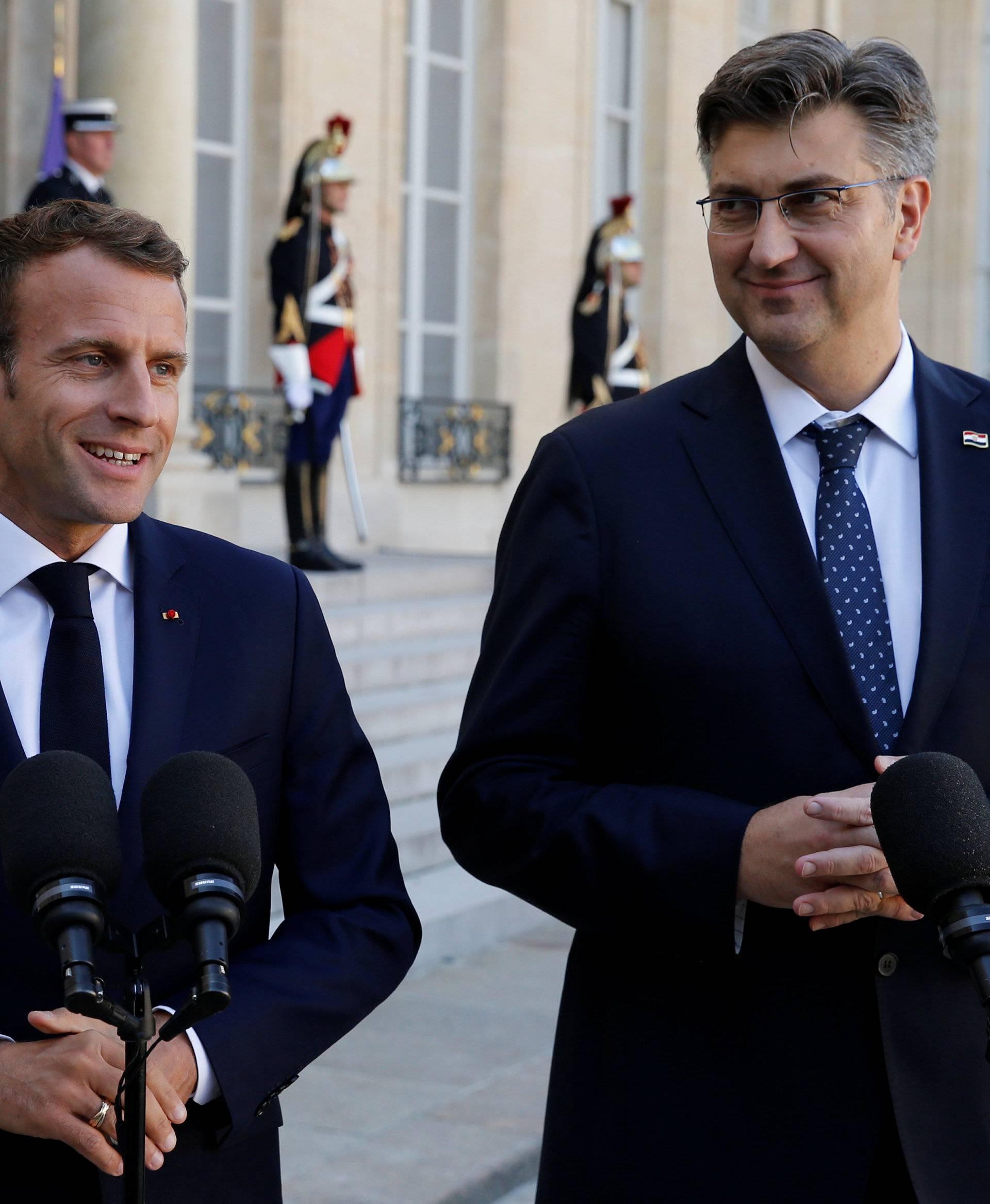 French President Emmanuel Macron and Croatian Prime Minister Andrej Plenkovic make a statement in the courtyard of the Elysee Palace in Paris