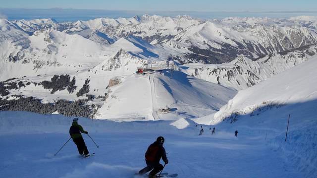 Guests speed down the Red Run during its official opening at Glacier 3000 in Les Diablerets