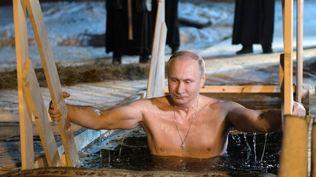 Russian President Vladimir Putin takes a dip in the water during Orthodox Epiphany celebrations at lake Seliger, Tver region