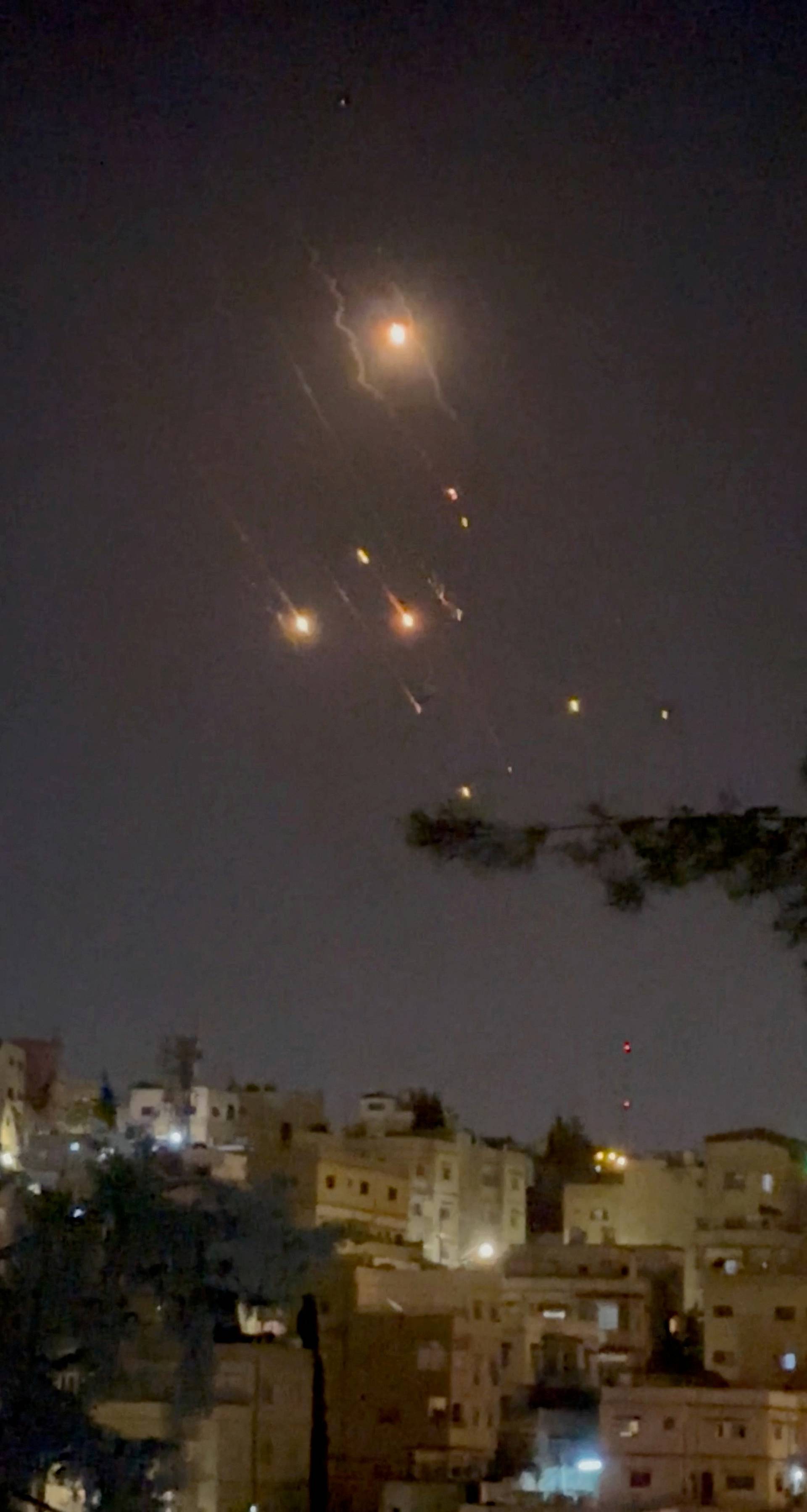 Objects are seen in the sky over Amman after Iran launched drones towards Israel