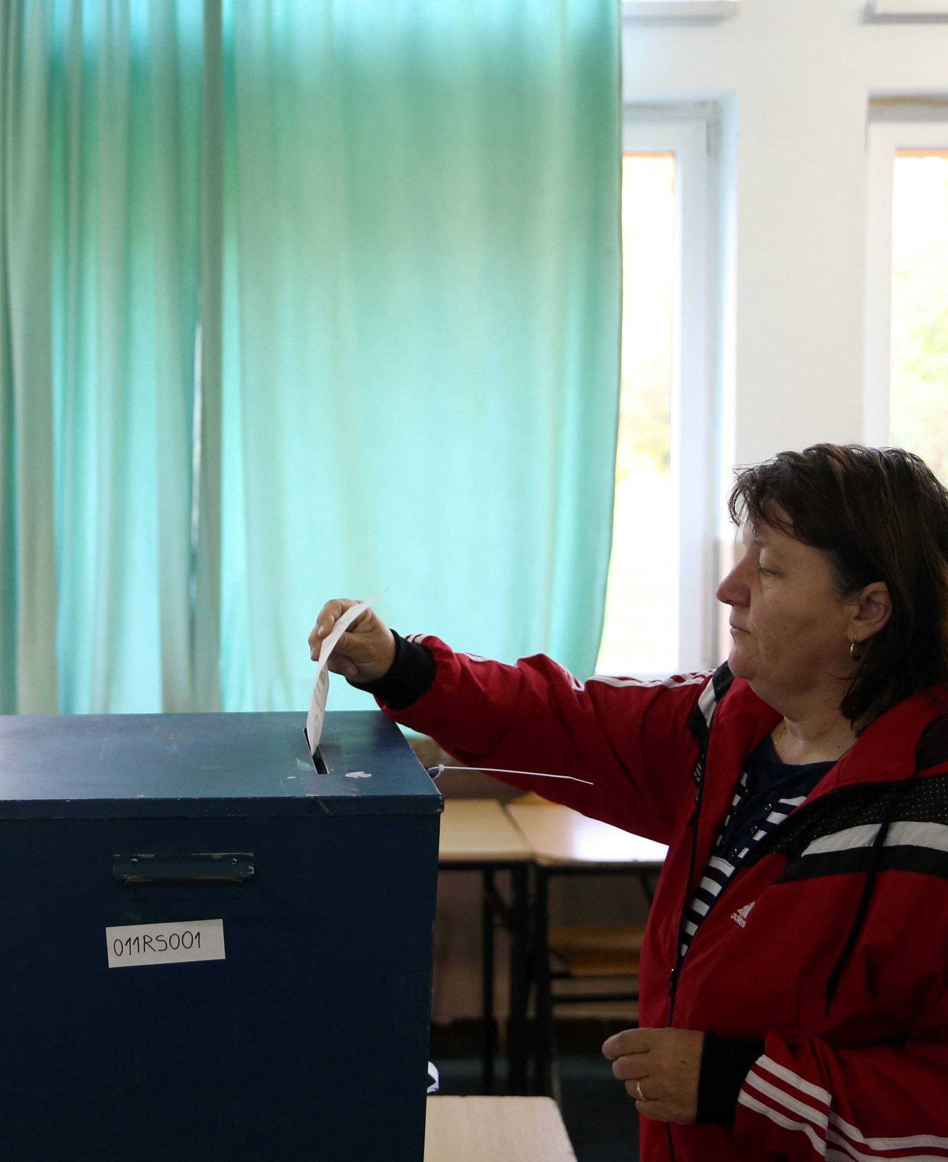 Woman votes for a referendum on their Statehood Day in Laktasi near Banja Luka