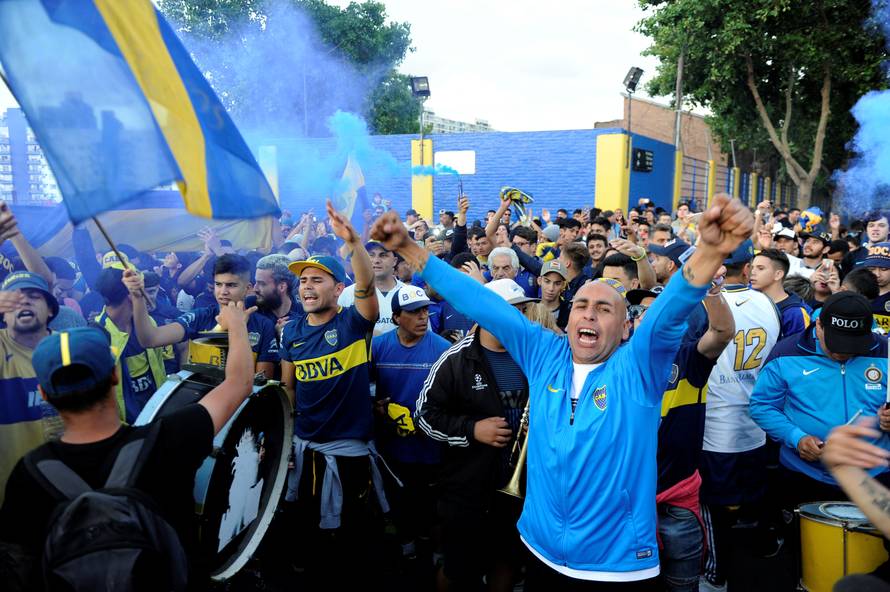 Boca Juniors' fans cheer as their team heads on to Spain to play the Copa Libertadores final, in Buenos Aires