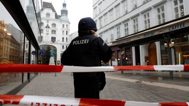 Police secure the area after shots were fired in a restaurant in Vienna