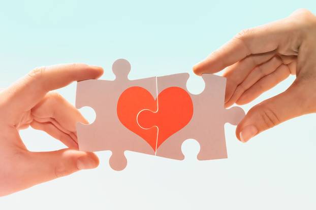 A,Man,And,A,Woman,Connect,Pieces,Of,A,Puzzle