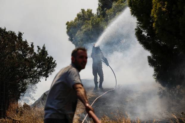 Wildfire burns in Markati