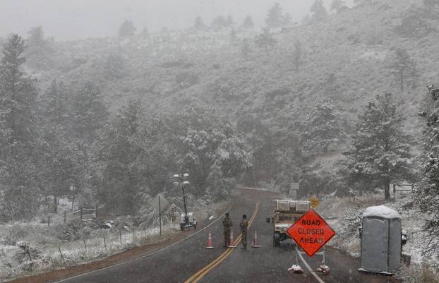 Central U.S. goes from heatwave to winter in a day as snowstorm rolls through the region