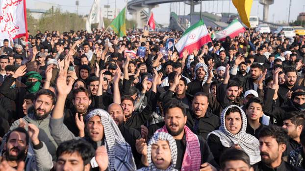 People march after Iran’s Supreme Leader Ayatollah Ali Khamenei was killed in Israeli and U.S. strikes, in Basra
