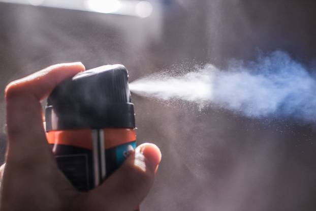 Human hand with atomizer