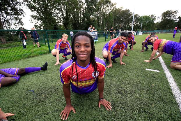 Clapton CFC players prepare for their away game with Healing Town in East Acton, in London