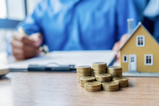 Car and House model with agent and customer discussing for contr