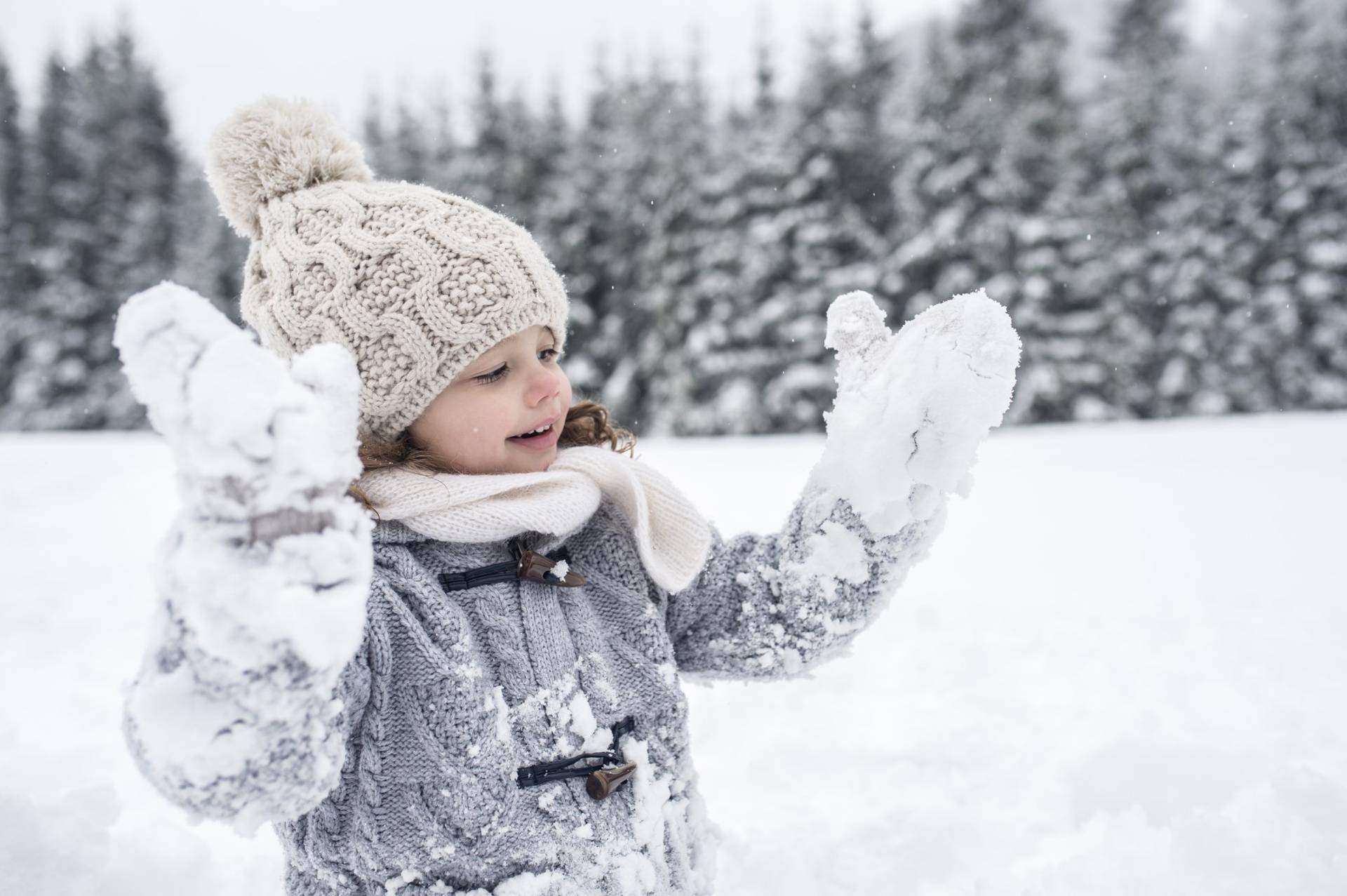 Happy girl in winter landscape