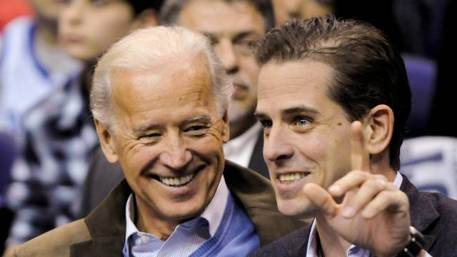 FILE PHOTO: U.S. Vice President Biden and his son Hunter attend an NCAA basketball game between Georgetown University and Duke University in Washington