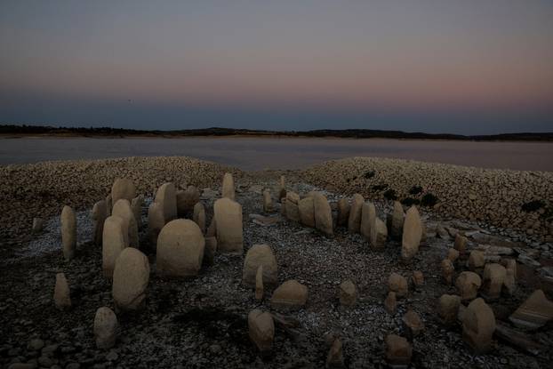 The dolmen of Guadalperal, also known as the Spanish Stonehenge, is seen due to the receding waters of the Valdecanas reservoir in the outskirts of El Gordo