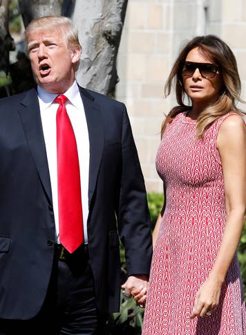 President Donald Trump and first lady Melania Trump arrive for the Easter service at Bethesda-by-the-Sea Episcopal Church in Palm Beach