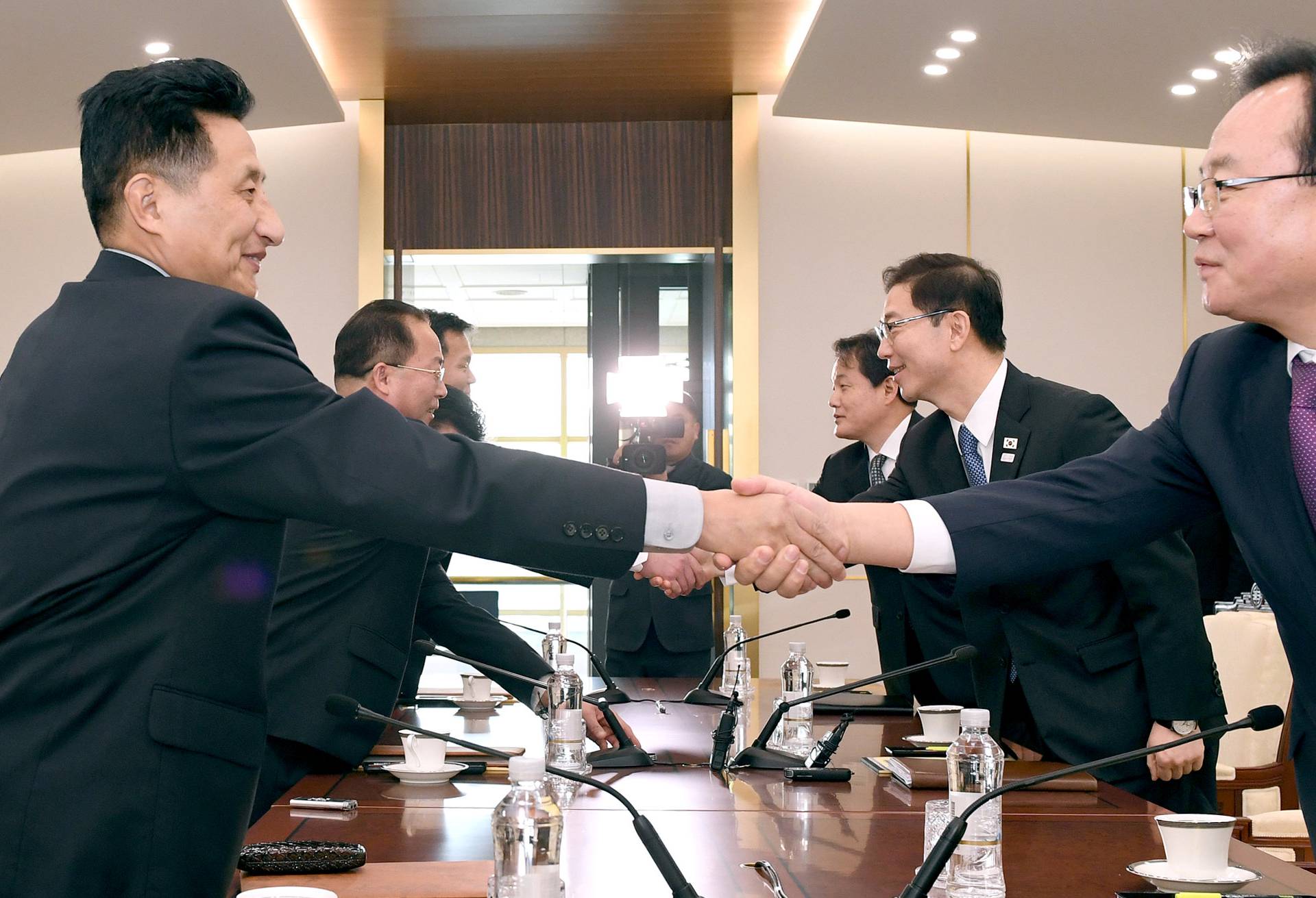 Head of North Korean delegation Jon Jong Su shakes hands with his South Korean counterpart Chun Hae-sung during their meeting at the truce village of Panmunjom