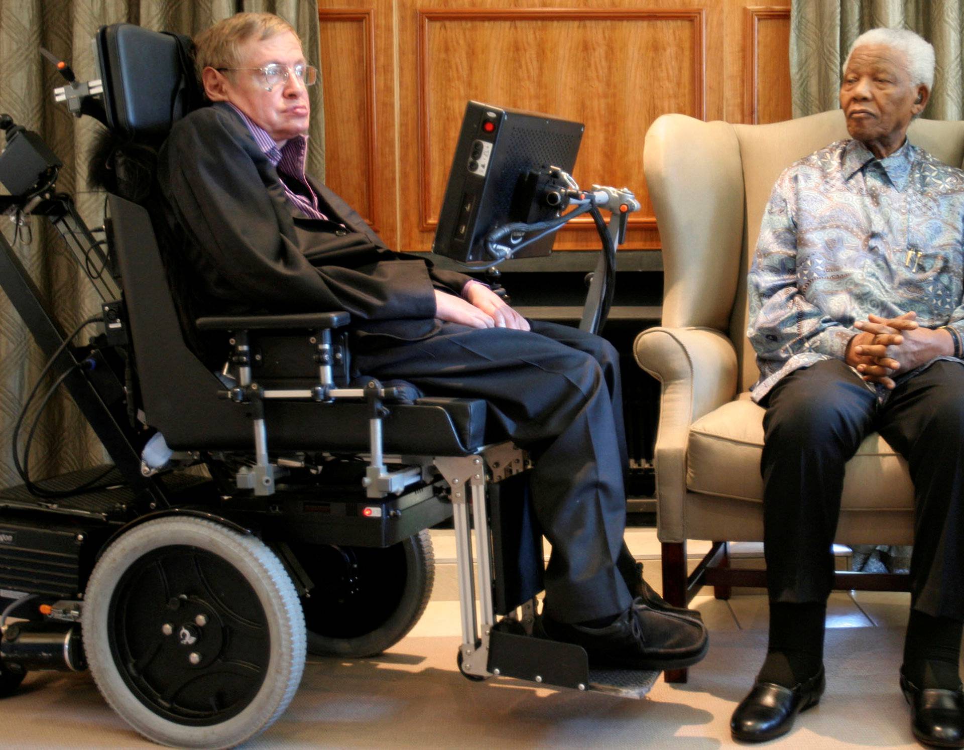 FILE PHOTO: Former South African President Mandela meets theoretical physicist professor Hawking at Mandela's Foundation office in Johannesburg