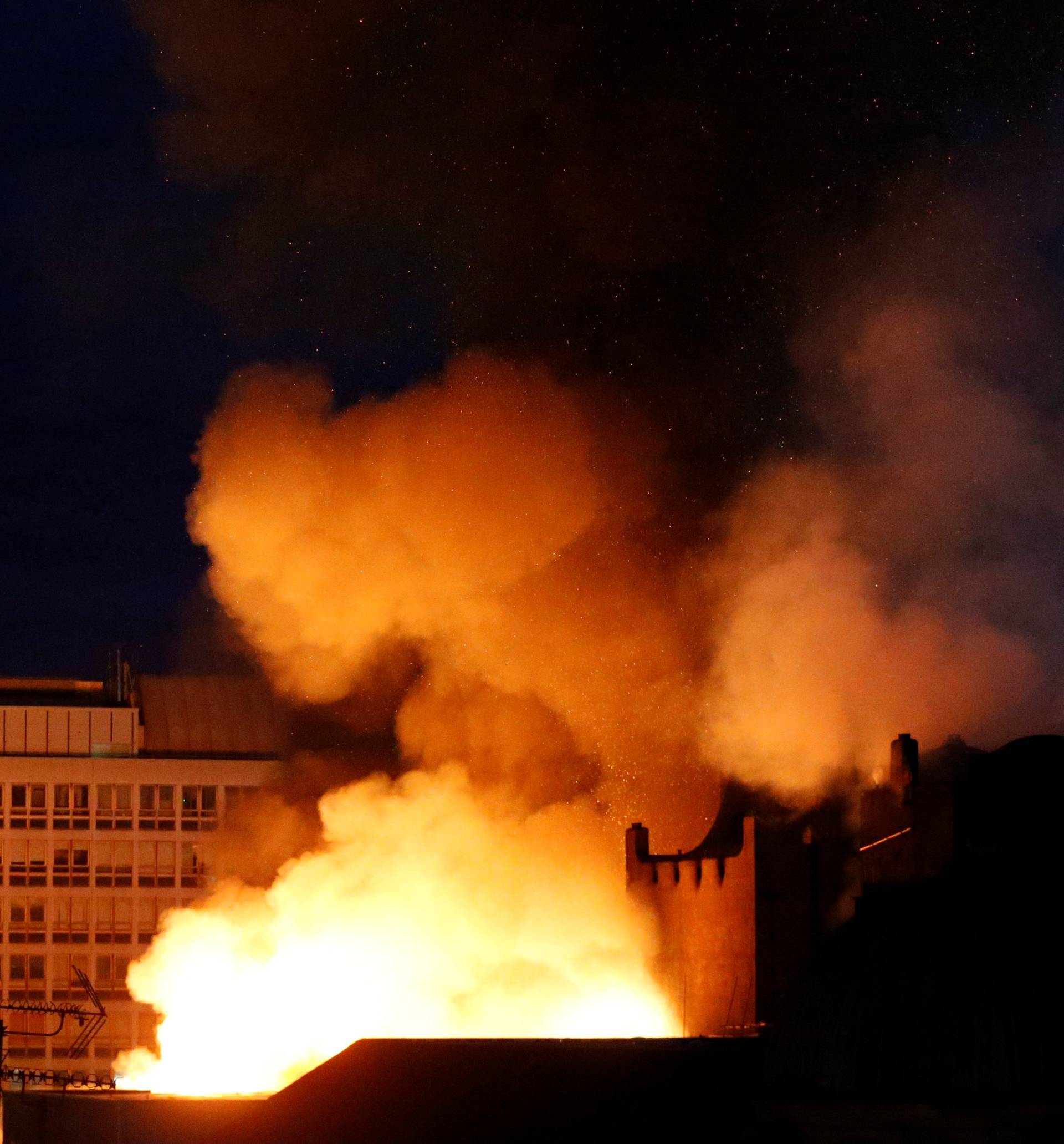 Firefighters attend to a blaze at the Mackintosh Building at the Glasgow School of Art, which is the second time in four years, Glasgow, Scotland, Britain