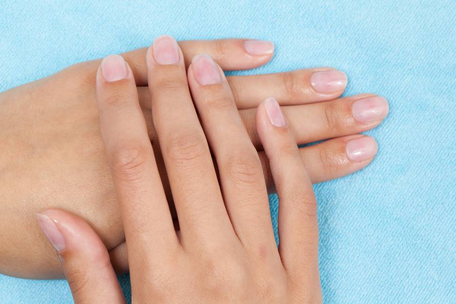 Woman hands on light blue background