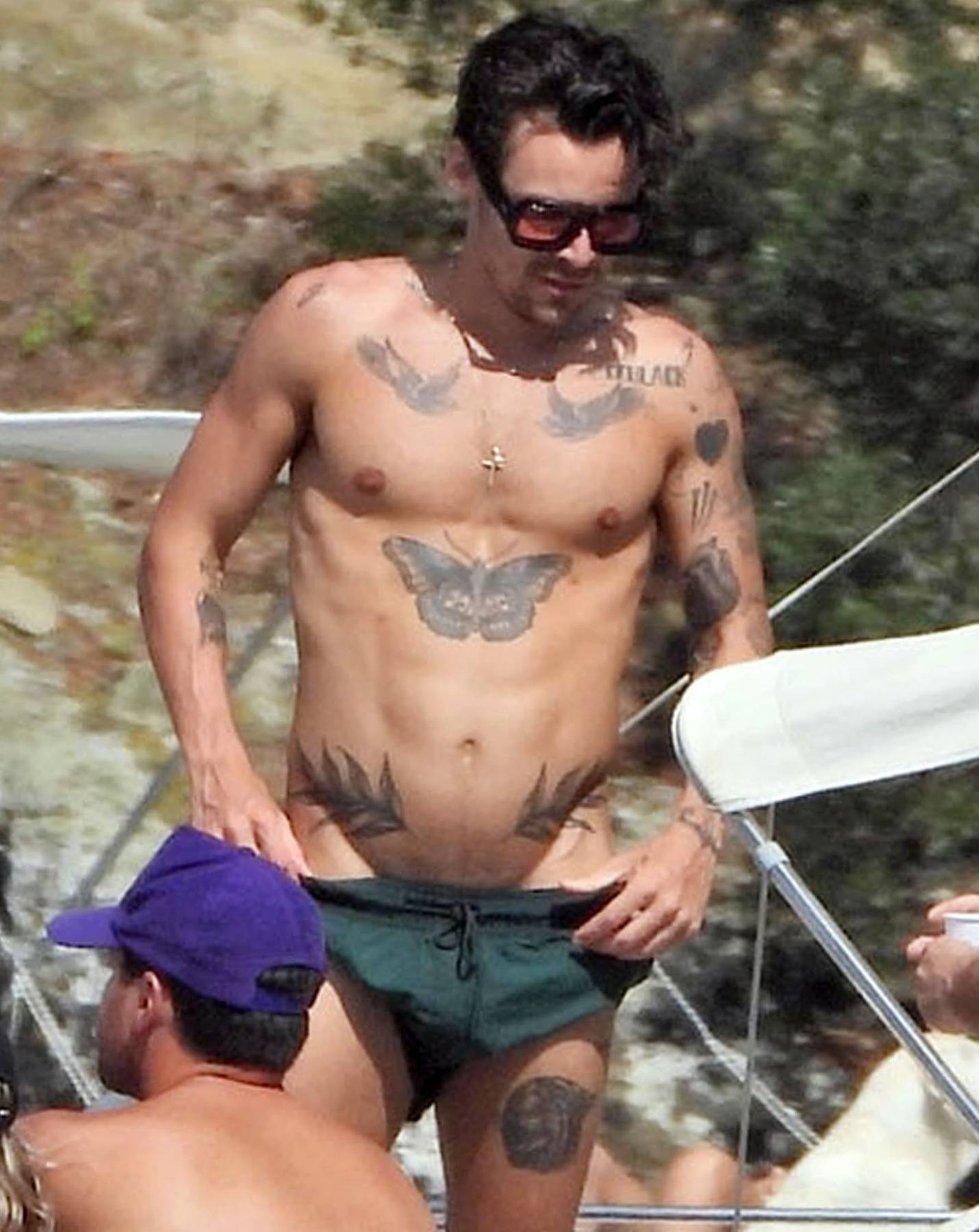 *PREMIUM-EXCLUSIVE* MUST CALL FOR PRICING BEFORE USAGE  - Harry Styles shows off his toned physique and his impressive array of tattoos on his Italian holiday with friends James Corden and Victoria's Secrets lingerie model Jacquelyn Jablonski out on Lake