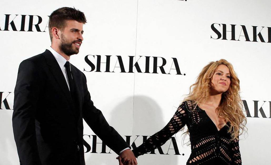 FILE PHOTO: Colombian singer Shakira and Barcelona's soccer player Gerard Pique pose during a photocall presenting her new album "Shakira" in Barcelona