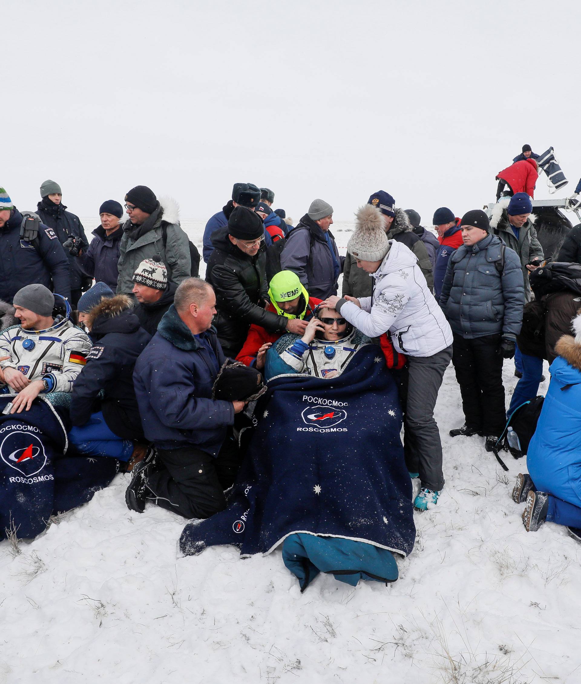 International Space Station crew members rest after landing near Zhezkazgan