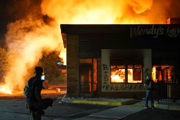 A Wendy’s burns following a rally against racial inequality and the police shooting death of Rayshard Brooks, in Atlanta