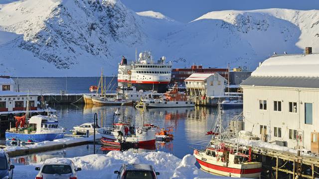 Harbour surrounded by snowcapped mountains, Norway