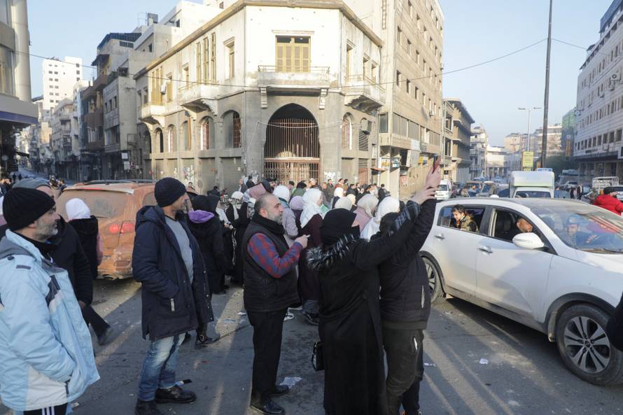People gather in the streets in Homs