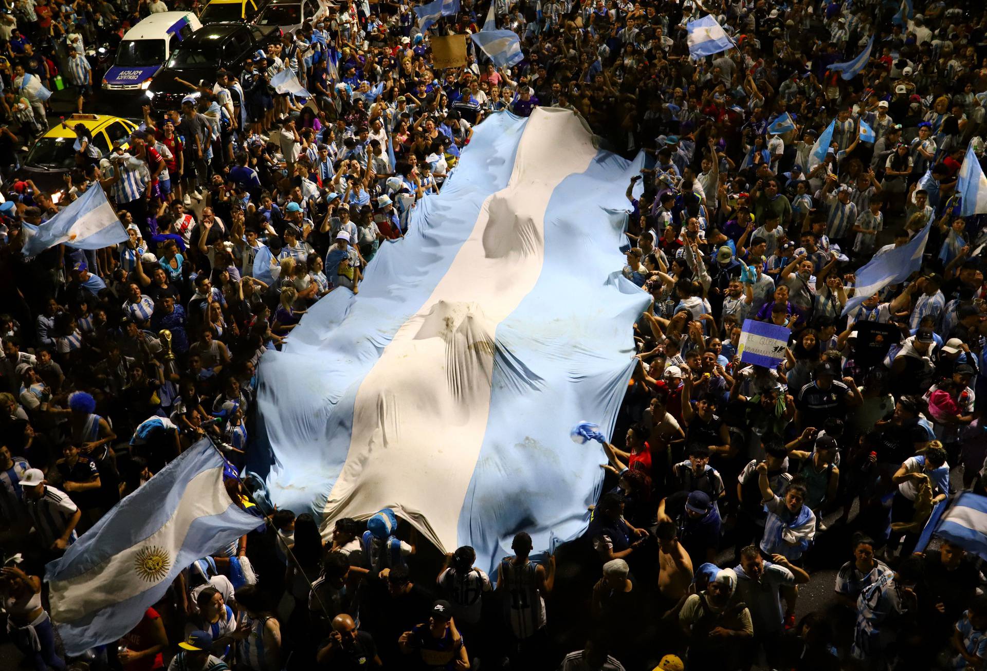 Fans in Buenos Aires celebrate after winning the World Cup