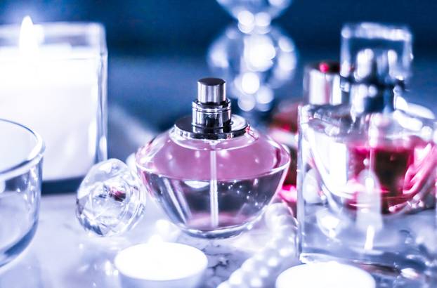 Perfume bottle and vintage fragrance on glamour vanity table at 