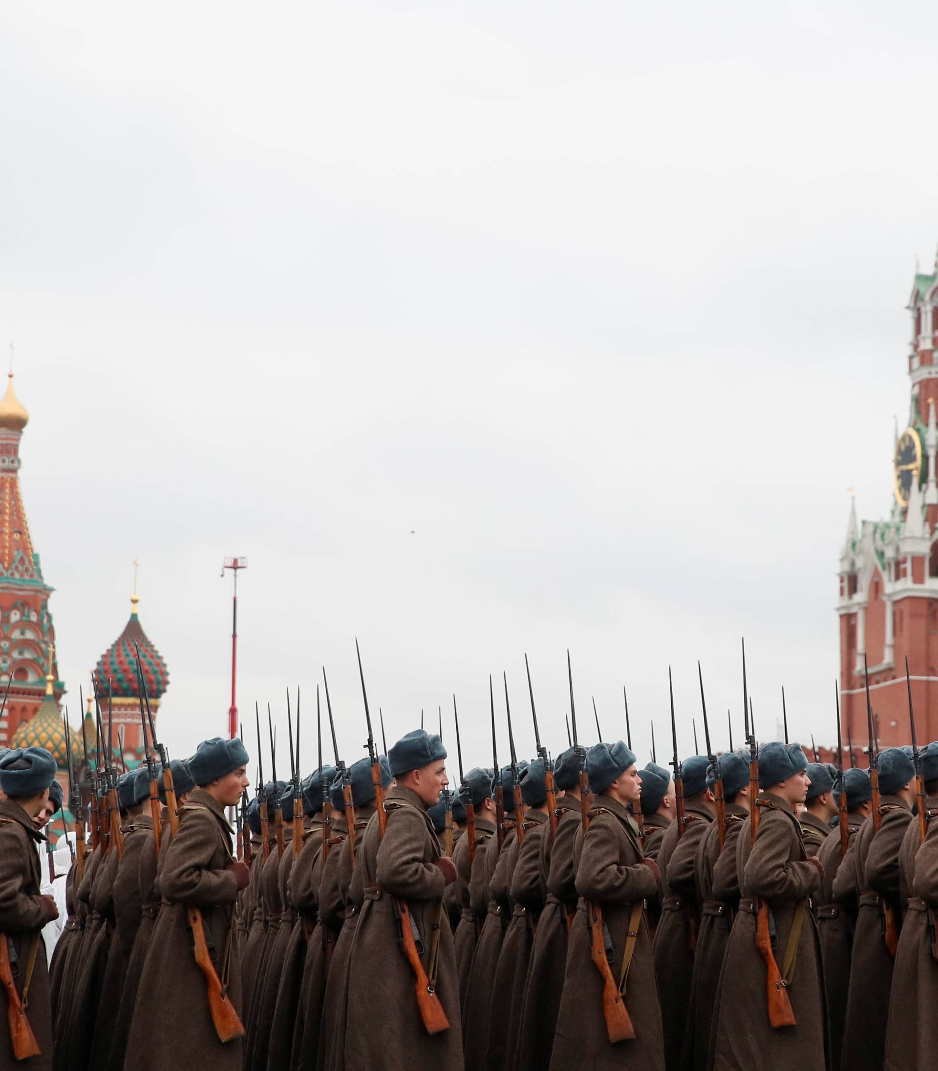 Russian servicemen dressed in historical uniform wait before a military parade marking the anniversary of the 1941 parade, when Soviet soldiers marched towards the front lines of World War Two, at Red Square in Moscow