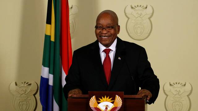South Africa's President Jacob Zuma smiles as he arrives to speak at the Union Buildings in Pretoria