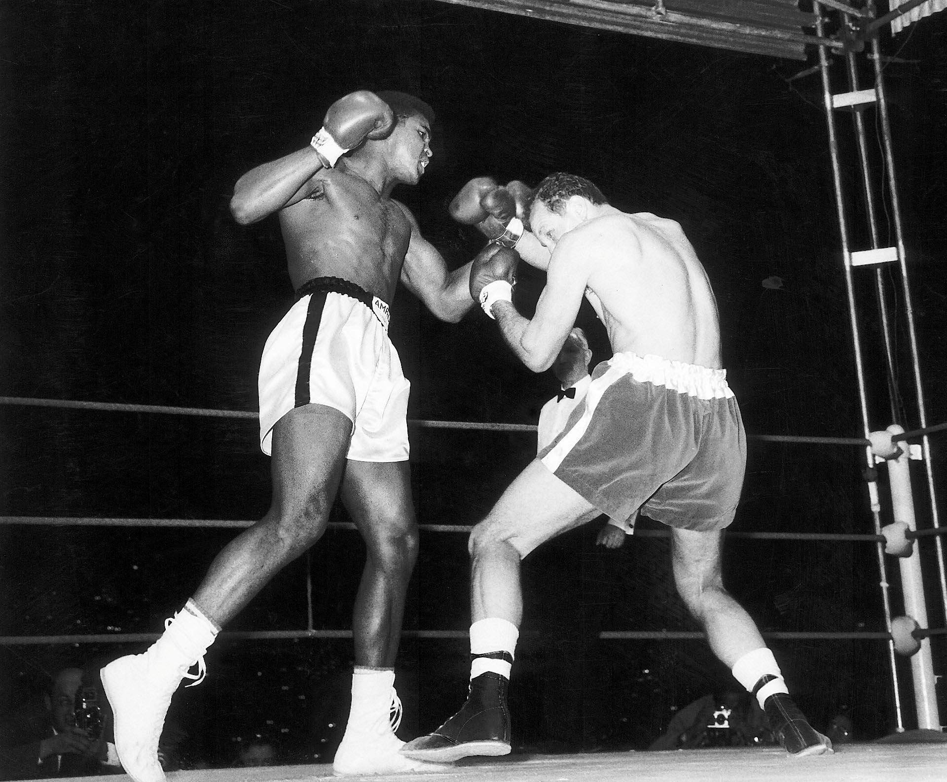  Cassius Clay, (later Muhammad Ali) fights Henry Cooper at Wembley Stadium in London