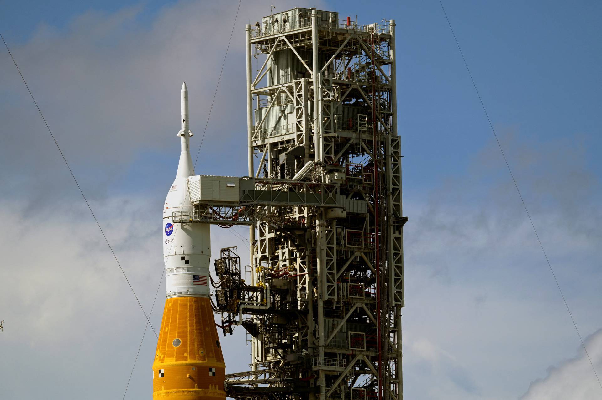 NASA's next-generation moon rocket, the Space Launch System (SLS) rocket with its Orion crew capsule perched on top, stands at launch complex 39-B