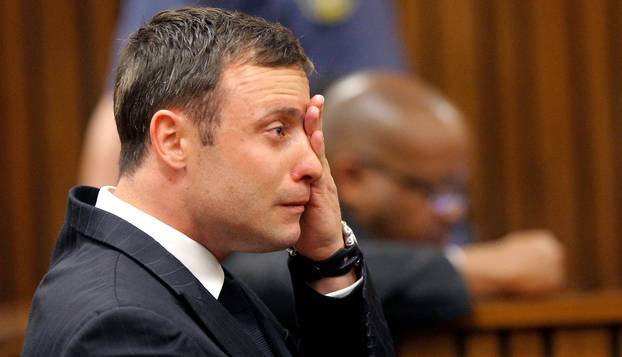 FILE PHOTO: Olympic and Paralympic track star Pistorius reacts as he listens to Judge Masipa's judgement at the North Gauteng High Court in Pretoria