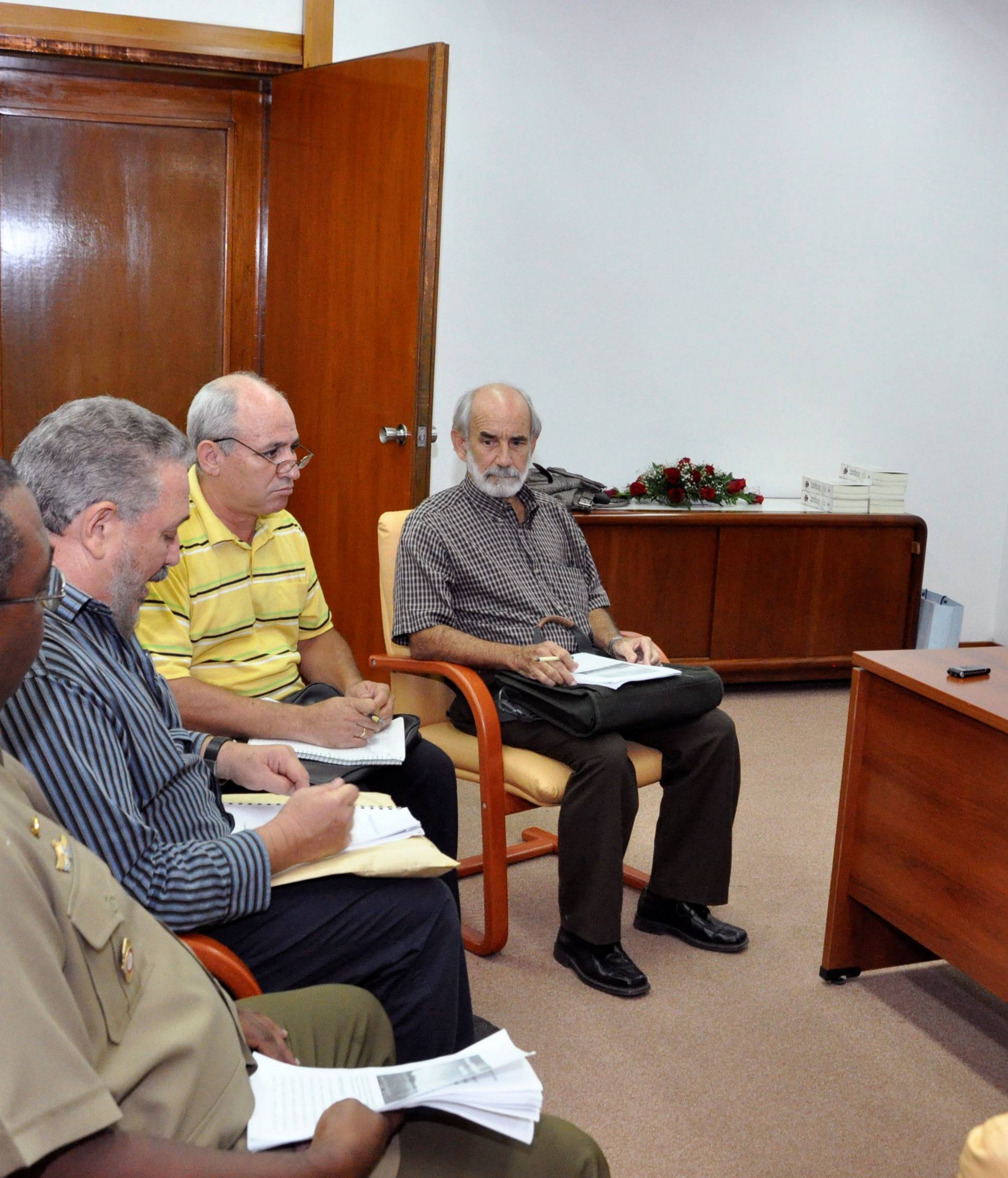 FILE PHOTO: Former Cuban leader Fidel Castro and his son Fidel Castro Diaz-Balart attend a meeting, in Havana